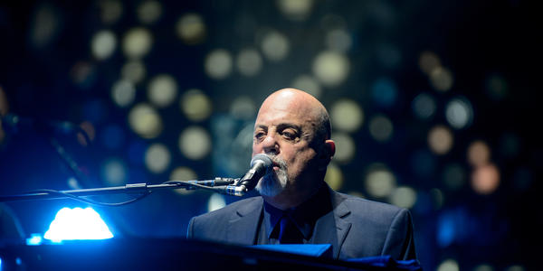 Bill Joel sings from his piano to the sold out crowd at the Bryce Jordan Center in 2014.