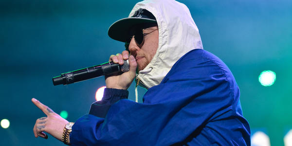 Mac Miller raps into handheld microphone to the packed audience at the Bryce Jordan Center in 2012.