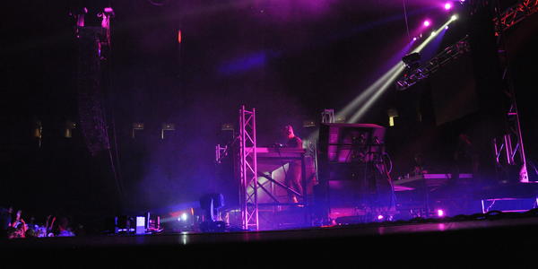 American D.J., Diplo, mixing dance music in a mix of purple pink lights for the crowd at the BJC. 